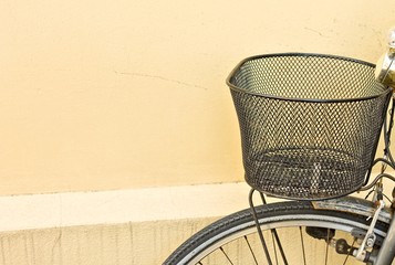 Metallic black basket of an old rusted bike (Pesaro, Italy, Europe)