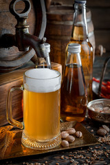 Light beer in a glass, on an old background.