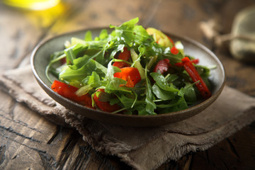 Healthy arugula salad with vegetables