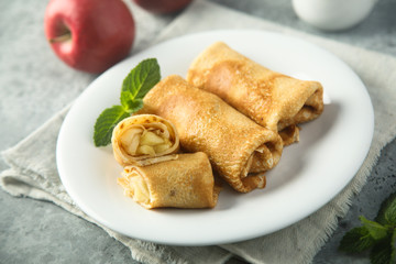 Crepes filled with apple and cinnamon