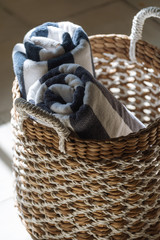 Obraz premium Two dry, clean large towels in wicker basket