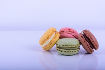 Colorful macaroons cake, sweet macaroon on white table background, food background