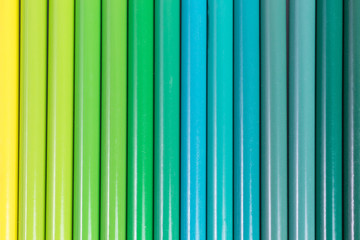 background of pencils in shades of green