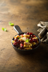 Traditional Austrian pancake dessert with cherry sauce