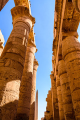Columns in the great hypostyle hall of the Karnak temple. Looking up
