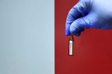 Corona virus or Covid-19 in Malta , sample blood tube in hand with Malta flag on background