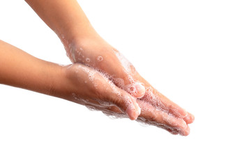 Close-up photo of soaped children's hands.