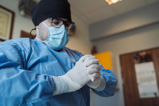 Doctor prepering for surgery in clinic.