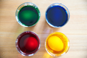 Cute creative photo with Easter eggs in a glass