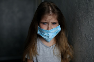 An excited child wearing a face shield to prevent viral infection or contamination. Quarantine