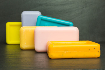 bars of soap in blue, orange, pink, purple and yellow