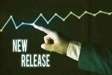 Writing note showing New Release. Business concept for announcing something newsworthy recent...