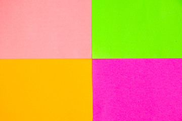 Multicolored paper background close-up.