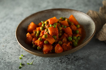 Homemade pumpkin curry with green pea