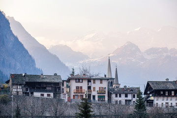 Several houses among the mountains in the early morning