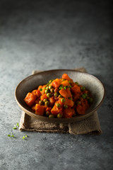 Homemade pumpkin curry with green pea