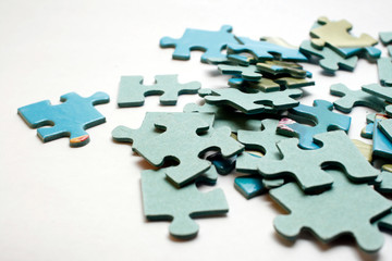 Blue puzzle pieces on white background.