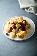 Traditional Austrian pancake dessert with cherry sauce