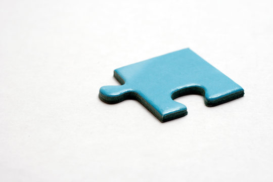 Blue puzzle pieces on white background.