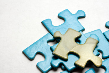 Fototapeta premium Blue puzzle pieces on white background.