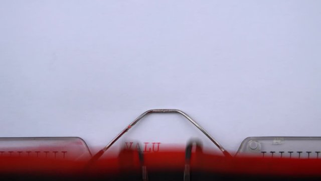 Value proposition - phrase printed on an old typewriter in red letters, close up. vintage inscription
