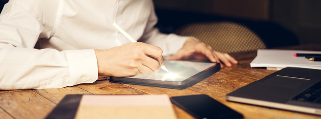 Male hands with digital tablet