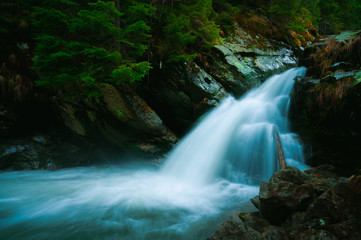 Fototapeta na wymiar Waterfall mountain view close up. Mountain river waterfall landscape. Waterfall river scene