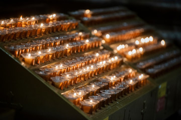 Burning candles in a church.