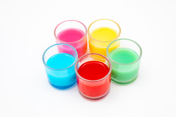colorful drinks in glass glasses with white background