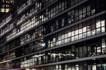 Obraz premium business office at night - corporate building