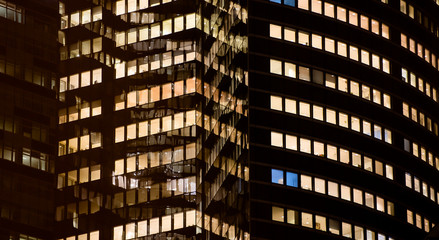 Obraz premium business office at night - corporate building