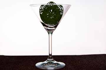 glass with Easter egg on a white background