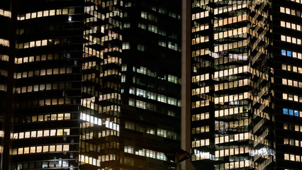 Obraz na płótnie Canvas business office at night - corporate building