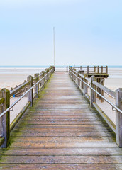 Obraz premium Wooden lookout facing the sea at the beach of Norddorf on the German North Sea island of Amrum
