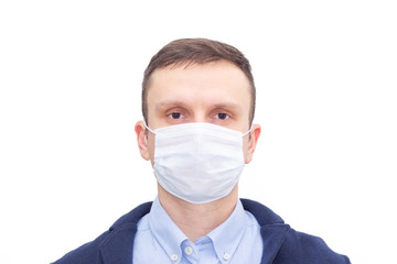 Portrait of a man on a white isolated background, face covered with a medical mask, banner for text. Health, awareness, and timeliness. Healthy lifestyle. No viruses.