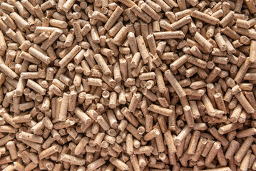 Wooden pellets background, pattern. Close up natural wood pellet. Ecological heating, renewable energy Biofuels. Top view. Flat lay ecological fuel for solid fuel boilers.