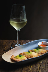 Chicken Empanadas La abuela style pastry puffs, spinach, green chimichurri sauce