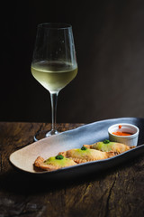 Chicken Empanadas La abuela style pastry puffs, spinach, green chimichurri sauce