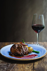 Alo Ribeye 250gm char-grilled ribeye with mashed potatoes & asparagus and a glass of red wine