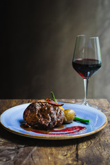 Alo Ribeye 250gm char-grilled ribeye with mashed potatoes & asparagus and a glass of red wine