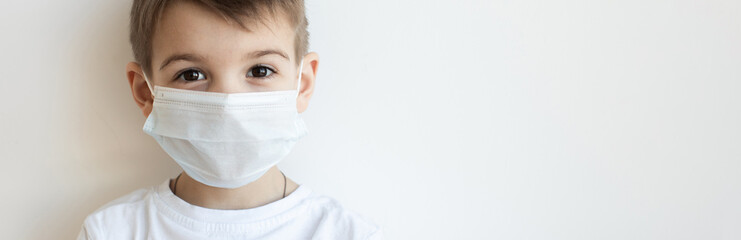 Concept of coronavirus quarantine. Child in mask . Protection against virus, infection. Health....