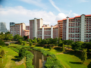 Obraz na płótnie Canvas Residential buildings in the background of a neighborhood park