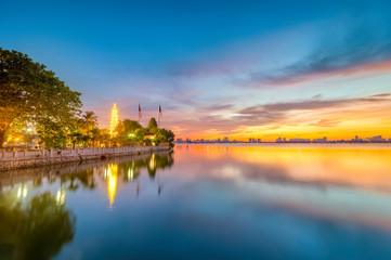 Naklejka premium Tran Quoc pagoda in the afternoon in Hanoi, Vietnam. This pagoda locates on a small island near the southeastern shore of West Lake. This is the oldest Buddhist temple and tourist destination in Hanoi