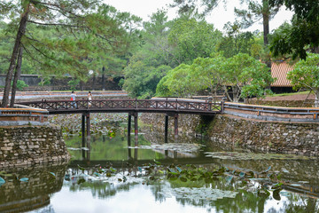 Fototapeta na wymiar Bridge crossing Luu Khiem Lake in the Tomb of Emperor Tu Duc. Hue, Vietnam