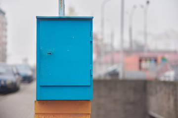 blue iron mailbox for sending letters.