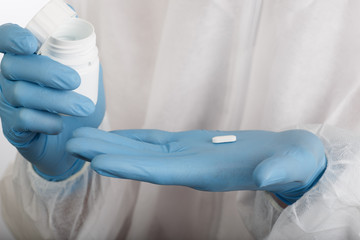 Closeup of hands in gloves with tablet