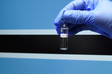 Corona virus or Covid-19 in Botswana , sample blood tube in hand with Botswana flag on background
