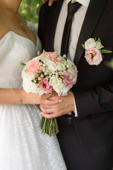 the bride and groom are holding a wedding bouquet