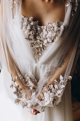 Bride in dress in detail