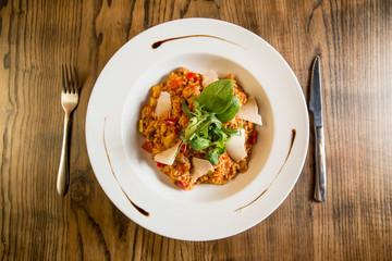 Risotto with vegetables in red sauce